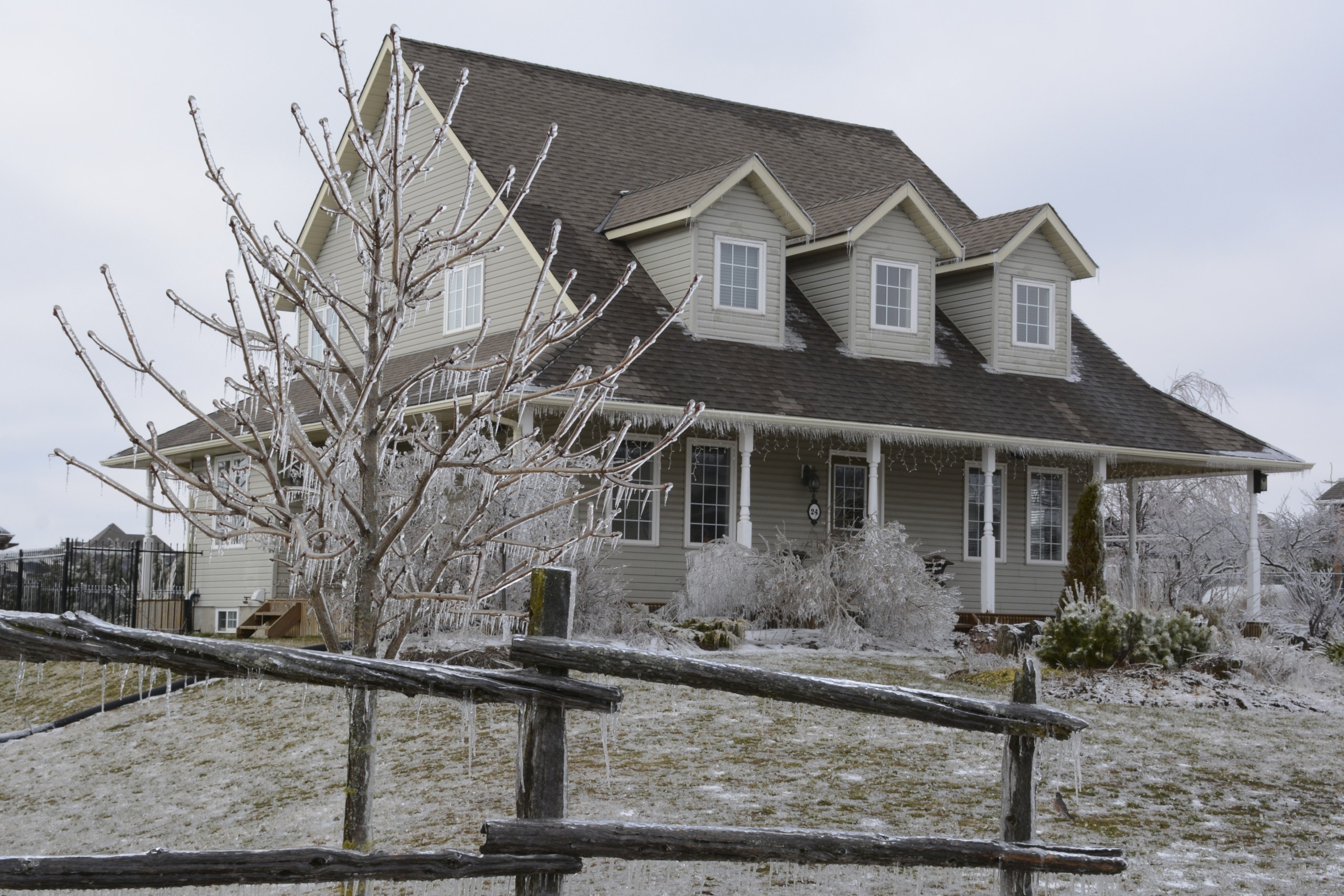 residential property covered in icicles after an ice storm
